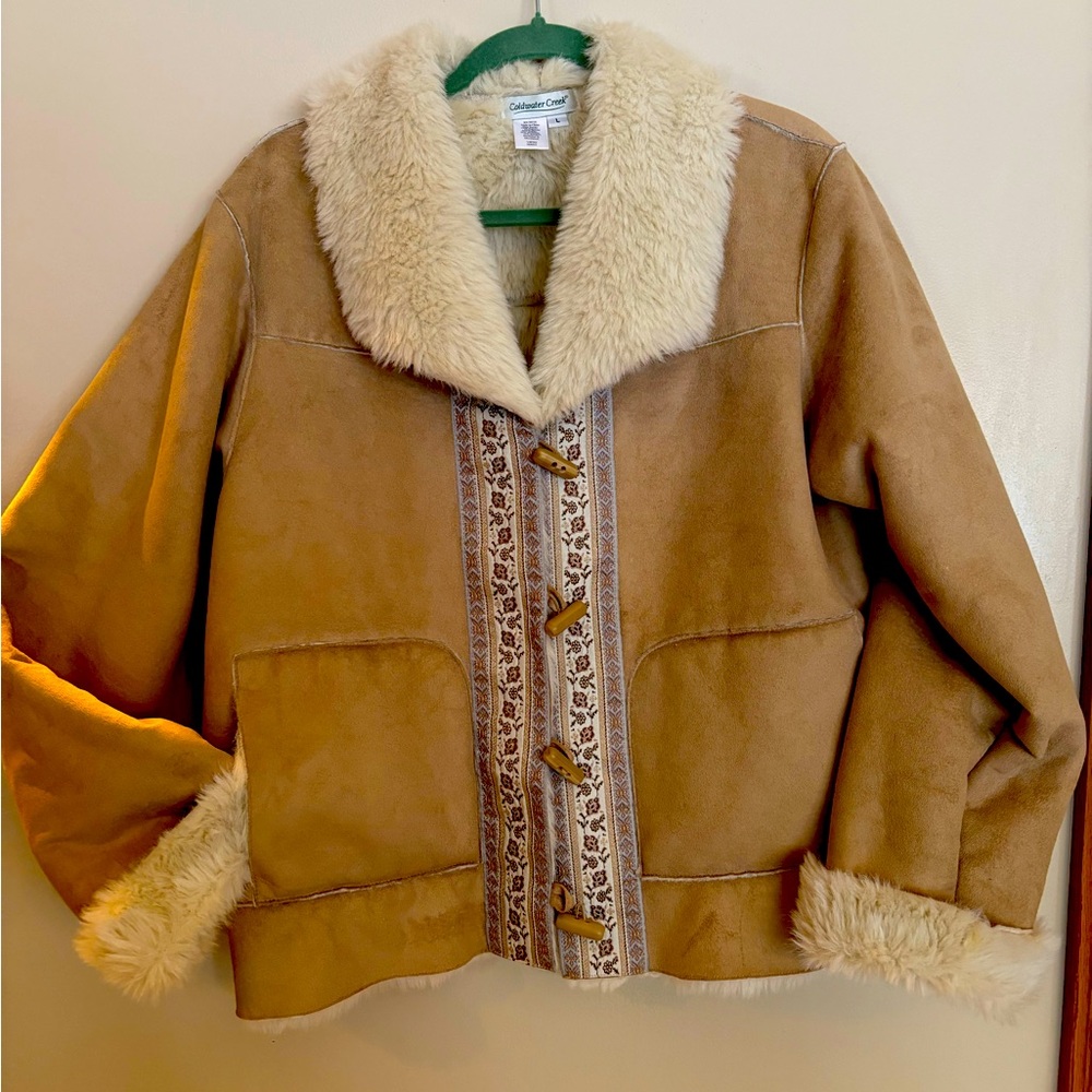 Faux suede, fur lined jacket. Beautiful detail down front of coat.